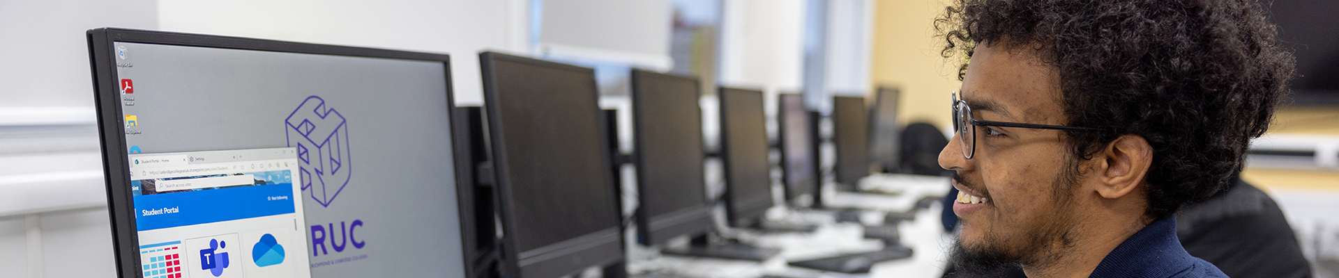 Male Harrow Weald student looking up the Student Portal in a computer lab